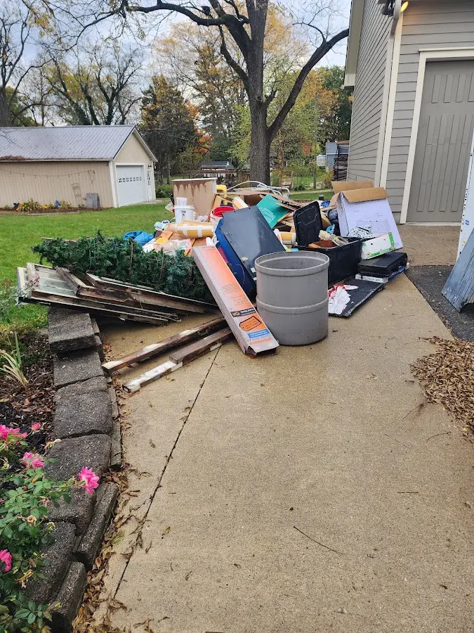 Dumpster being loaded with debris for 30 Yard Dumpster Rental in Kingsburg